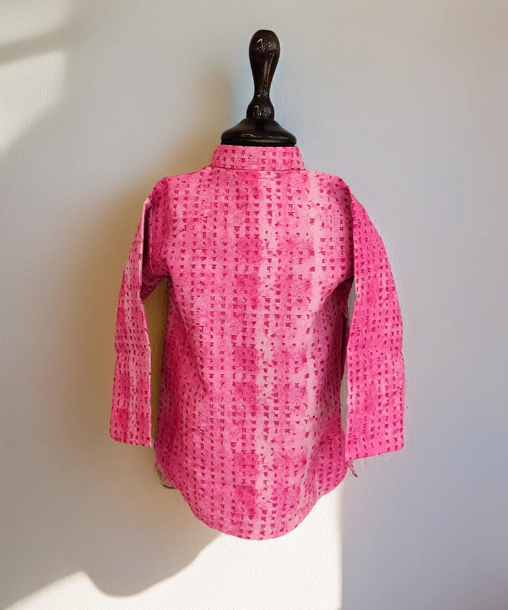 Pink textured shirt on a mannequin against a white background