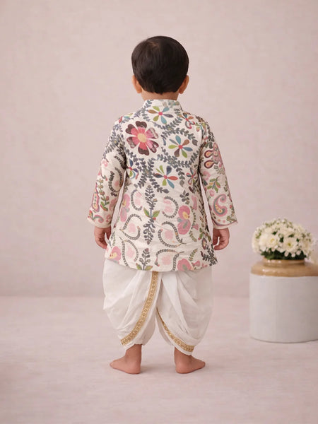 Child wearing a traditional outfit with floral patterns on a plain background