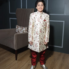 Self-embroidered cream sherwani set with maroon pyjama for boys, Jaipur ethnic fashion