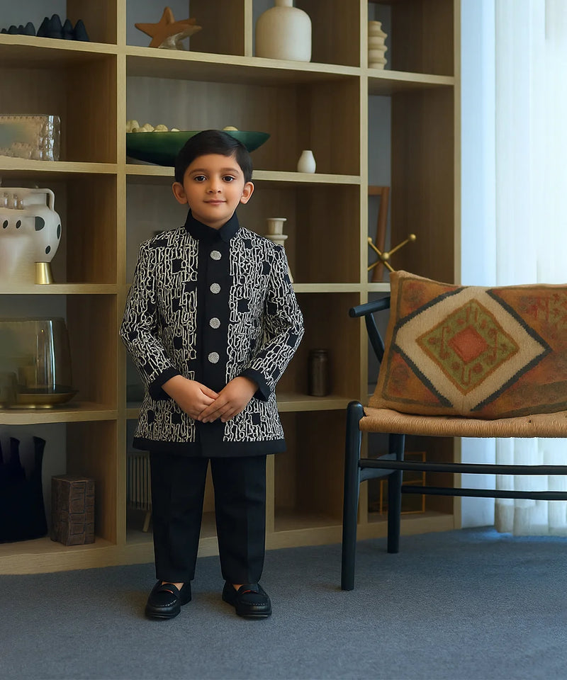 Child standing in a room with a bookshelf and chair in the background