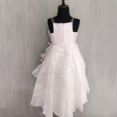 White dress on a mannequin against a plain background