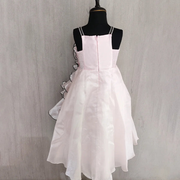 White dress on a mannequin against a plain background