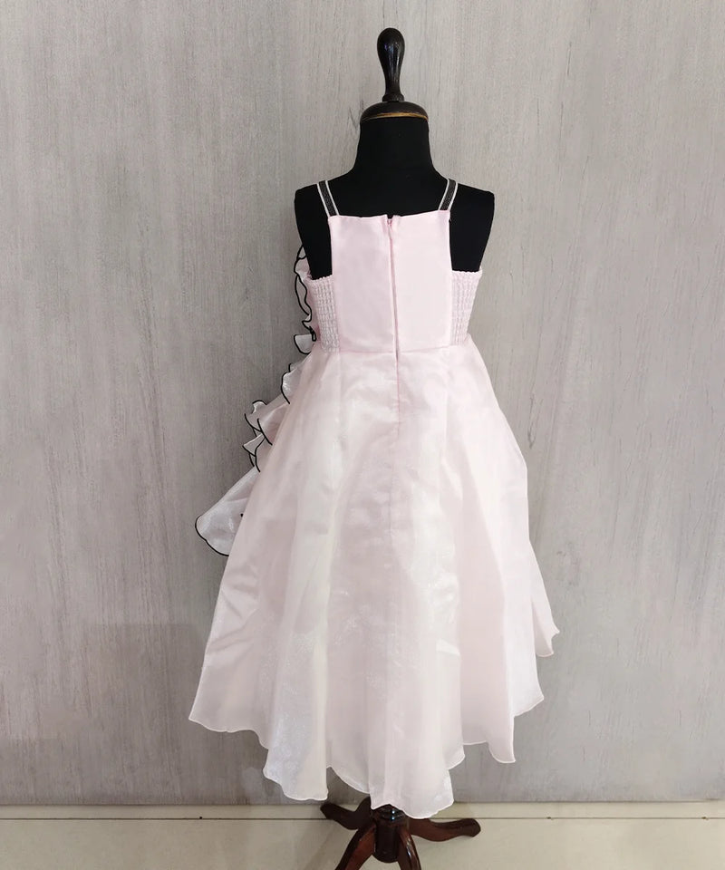 White dress on a mannequin against a plain background