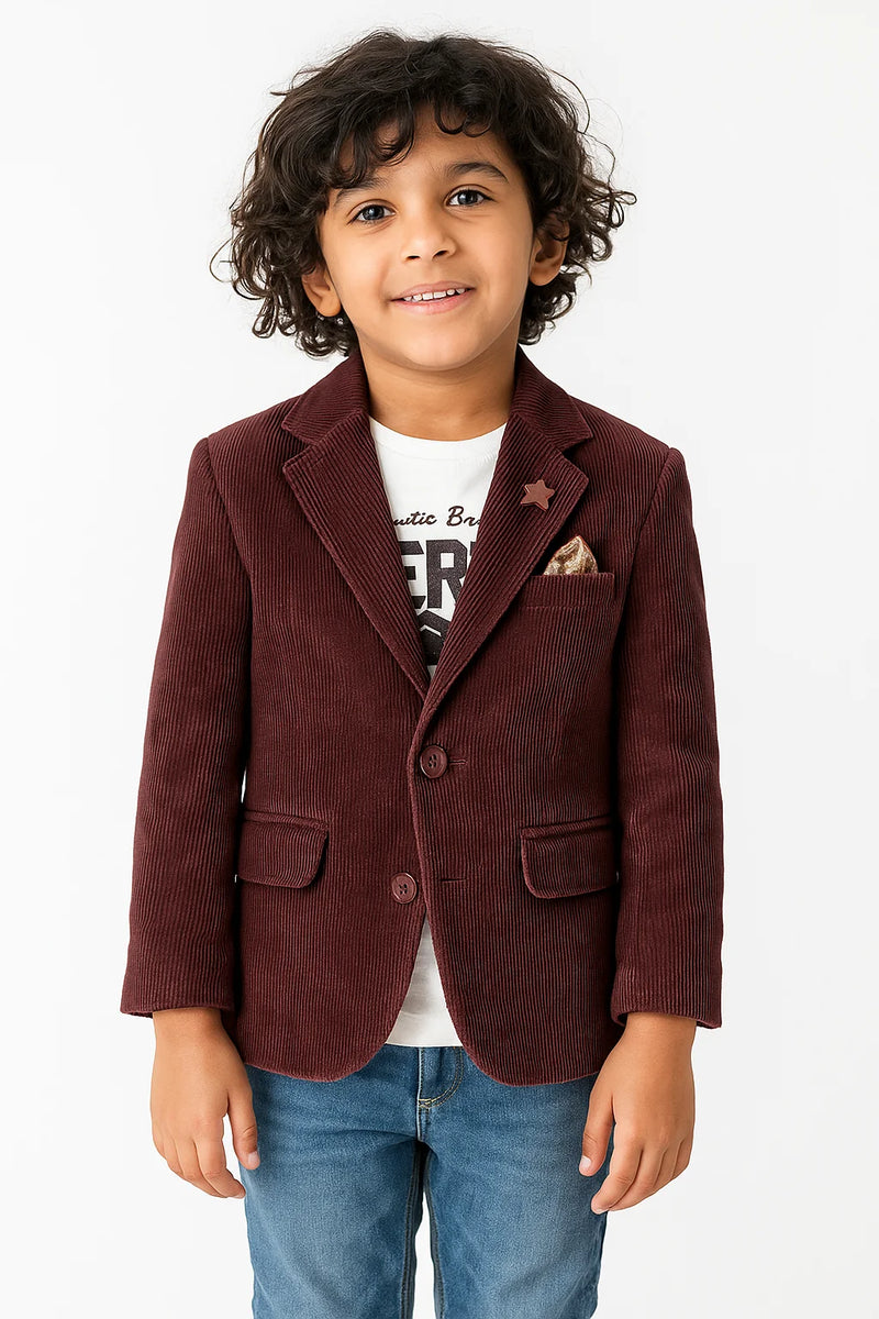 Child wearing a brown corduroy blazer over a white shirt with text, on a white background