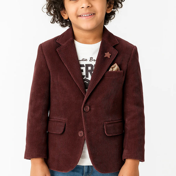 Child wearing a brown corduroy blazer over a white shirt with text, on a white background