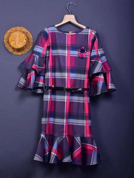 It is a multi Colored checked dress with a white belt for girls. This dress comes with floral and stone detailing and the belt has a written inscription on it.