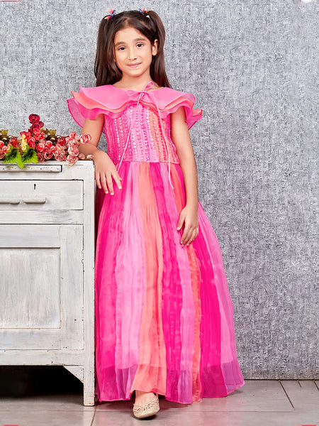 This pink and peach Colored dress consists of a gown and a short triple layer cape. It features floral work on the yoke part of the gown.