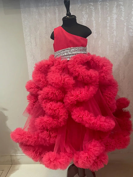 It’s a fancy pink ruffle gown that comes with a side zip closure and is a perfect children birthday dress. It features pleated and sequin fabric detailing that uplifts the entire look.