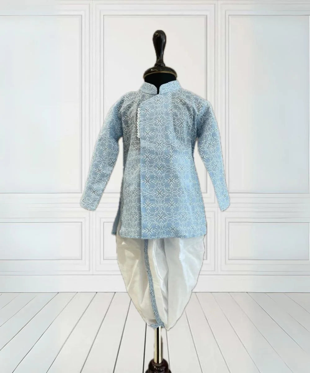 It is a sky blue Colored printed kurta teamed up with a dhoti pant, that can be creatively styled with ethnic shoes and is the best boy's designer kurta-pyjama set.