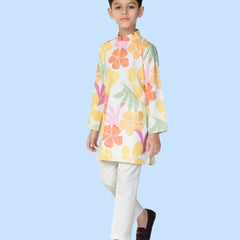  It is a printed white kurta teamed up with a matching pyjama, that can be creatively styled with ethnic shoes and is the best boy's designer kurta-pyjama set.