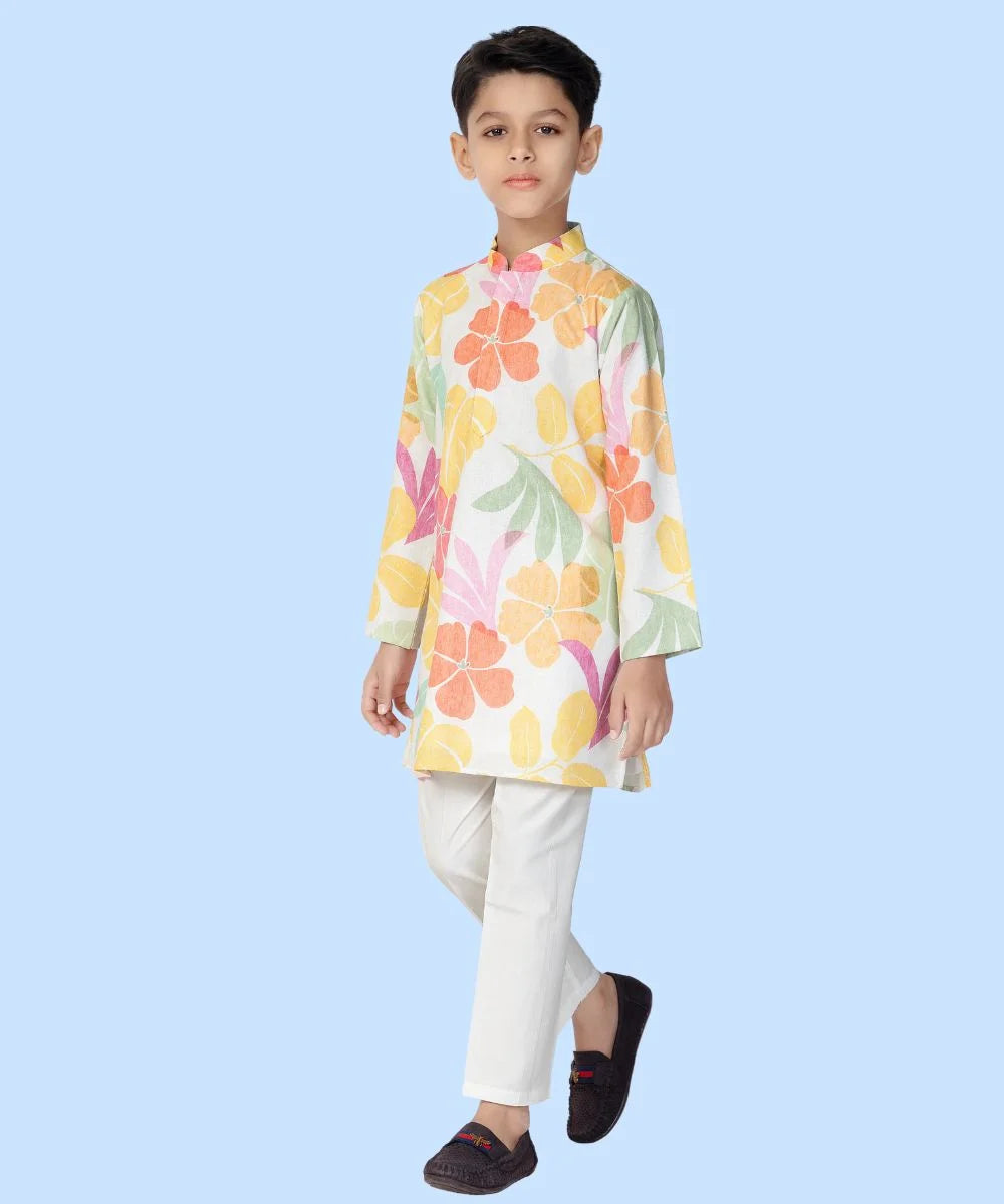  It is a printed white kurta teamed up with a matching pyjama, that can be creatively styled with ethnic shoes and is the best boy's designer kurta-pyjama set.
