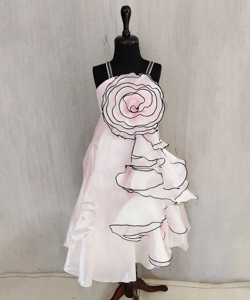 Mannequin wearing a white dress with floral design on a plain background