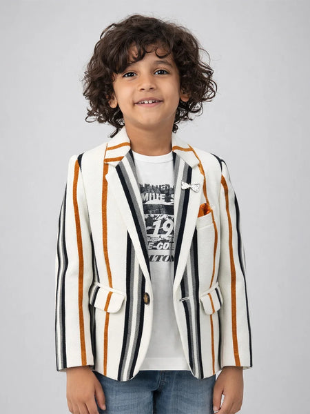 Child wearing a striped blazer over a graphic t-shirt on a plain background