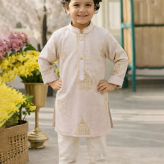 Child wearing a traditional outfit with floral decorations in the background