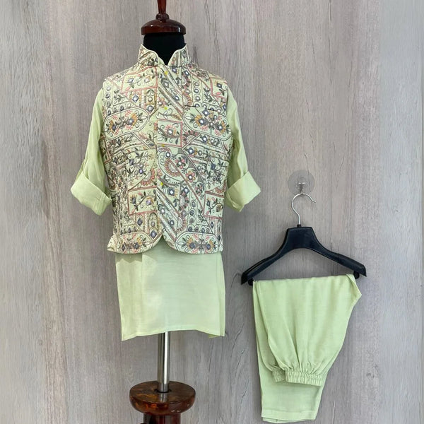  It's a pista green Colored kurta and pyjama teamed up with a beautiful embroidered waistcoat. It is the best boy's designer kurta-pyjama set.
