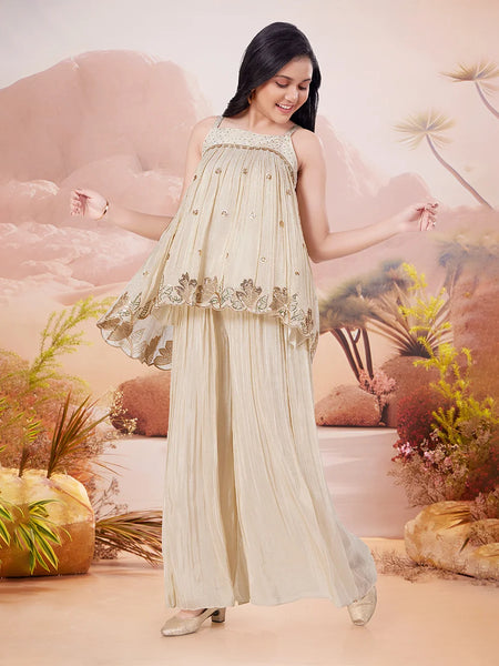 Girl in a beige dress with floral patterns against a desert landscape background