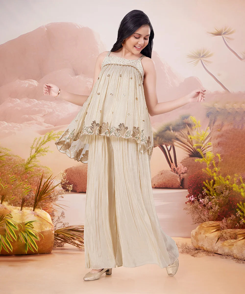 Girl in a beige dress with floral patterns against a desert landscape background