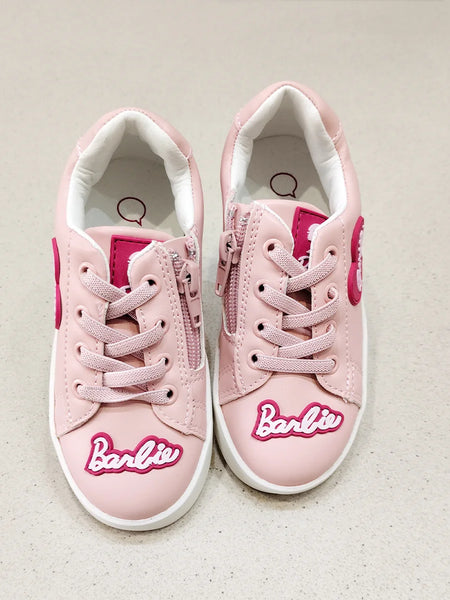 Pink sneakers with 'Barbie' logo on a light background
