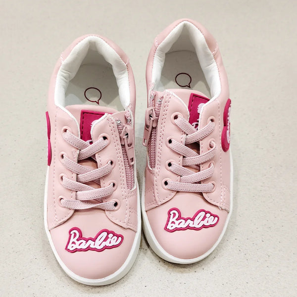 Pink sneakers with 'Barbie' logo on a light background