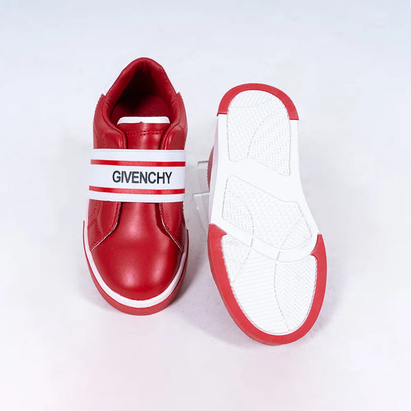 Close-up of girls' fashion red sneakers with white band and flexible sole, Jaipur

