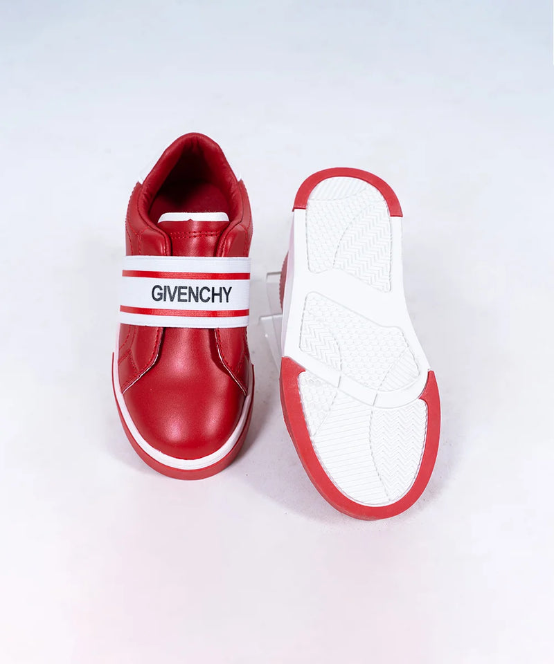 Close-up of girls' fashion red sneakers with white band and flexible sole, Jaipur


