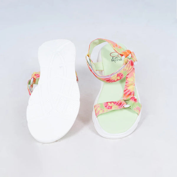 Close-up of trendy girls' summer sandals with vibrant tie-dye straps and white sole, Jaipur