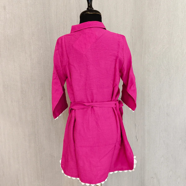 Pink robe on a mannequin against a neutral background