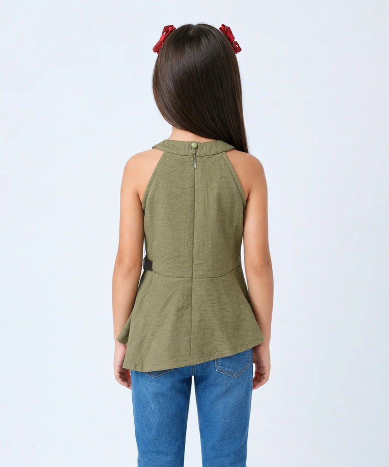 A child model shown from the back wearing an olive green sleeveless top with a buttoned neckline and peplum hem, paired with blue jeans against a light gray studio background.