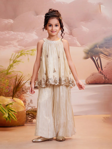 Cream palazzo set for girls with embellished sleeveless top and wide-leg pants, Jaipur wedding style

