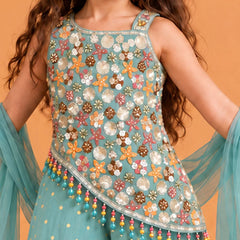 Asymmetrical slanted bottom hemline on the top featuring multi-colored hanging beaded tassels.   