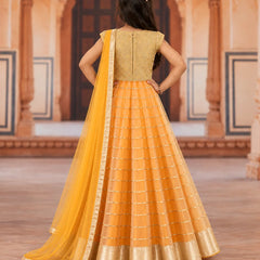 Back view of girls' orange lehenga with beige brocade top and dupatta