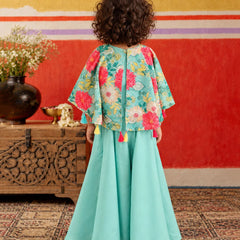 Bright tassel hanging embellishments along the shirt hemline.   