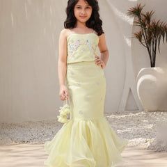 Girl wearing a light green crop top lehenga set