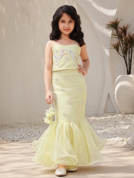 Girl wearing a light green crop top lehenga set
