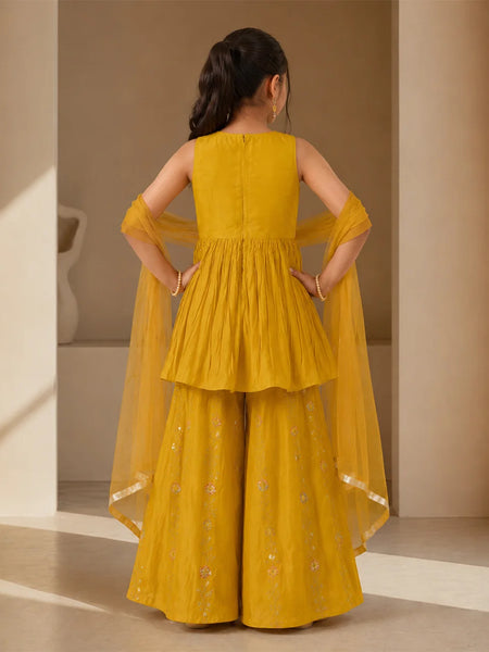 Mustard yellow sleeveless kurta with matching sharara and dupatta.