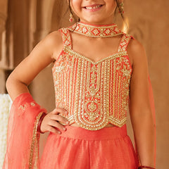 Orange sleeveless top with matching flared sharara.
