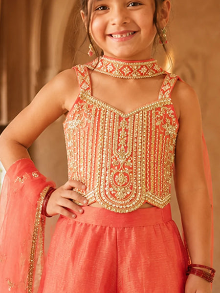 Orange sleeveless top with matching flared sharara.