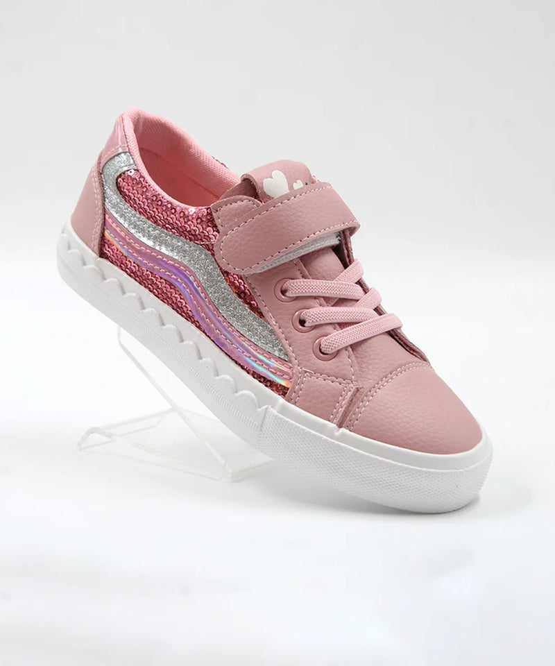 Pink children's sneaker with a white sole on a light gray background
