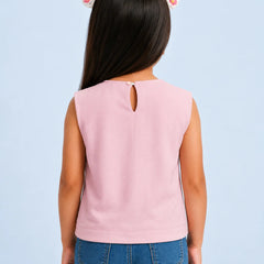 A child model shown from the back wearing a sleeveless light pink top with a small keyhole cutout at the neckline, paired with blue jeans against a light blue background.