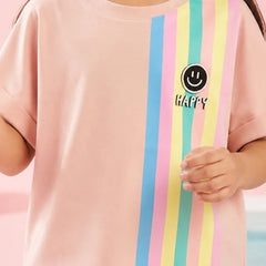 A child wearing a light pink short-sleeve t-shirt with vertical pastel stripes in blue, pink, yellow, and mint green on the right side. A black circular smiley face graphic with the word 'HAPPY' is printed on the chest.