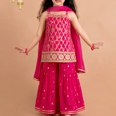 Sleeveless rani pink kurta with flared sharara and dupatta.