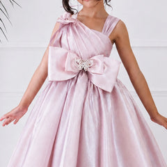 Pink dress with a large bow and butterfly detail on a white background