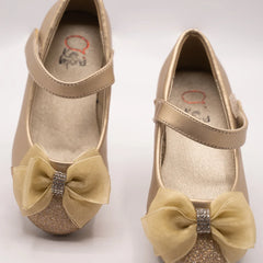 Close-up of girls' gold ballerina shoes with sparkling toe and bow accent, perfect for festive occasions in Jaipur