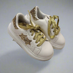 Close-up of trendy girls' white sneakers with gold glitter accents and cushioned sole, Jaipur