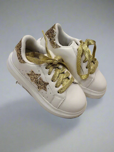 Close-up of trendy girls' white sneakers with gold glitter accents and cushioned sole, Jaipur