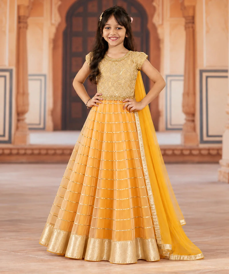 Girls' orange lehenga with beige brocade top and dupatta