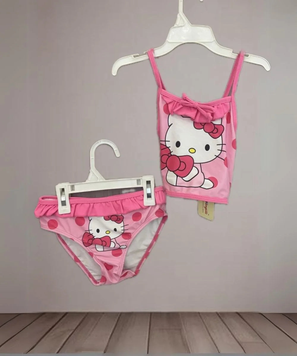 It is a kid's pool party wear Swimsuit that has a kitty print and frill detailing on it.