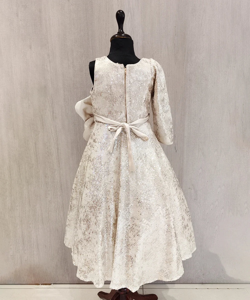 White lace dress on a mannequin against a plain background
