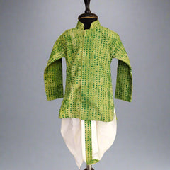 A green and white dotted dhoti-kurta set for boys displayed on a mannequin.