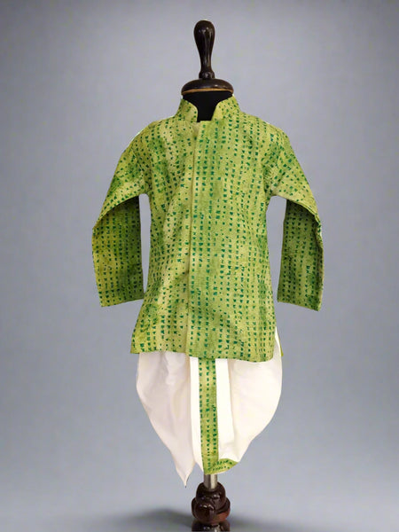 A green and white dotted dhoti-kurta set for boys displayed on a mannequin.